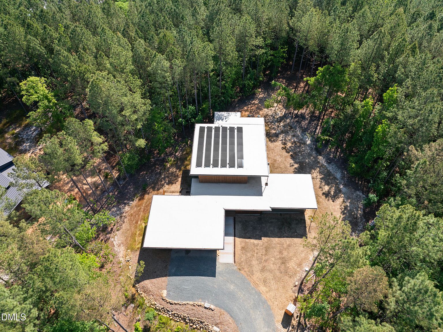 Aerial detail of the rooftop solar panels feeding the all-electric, net-zero residence
